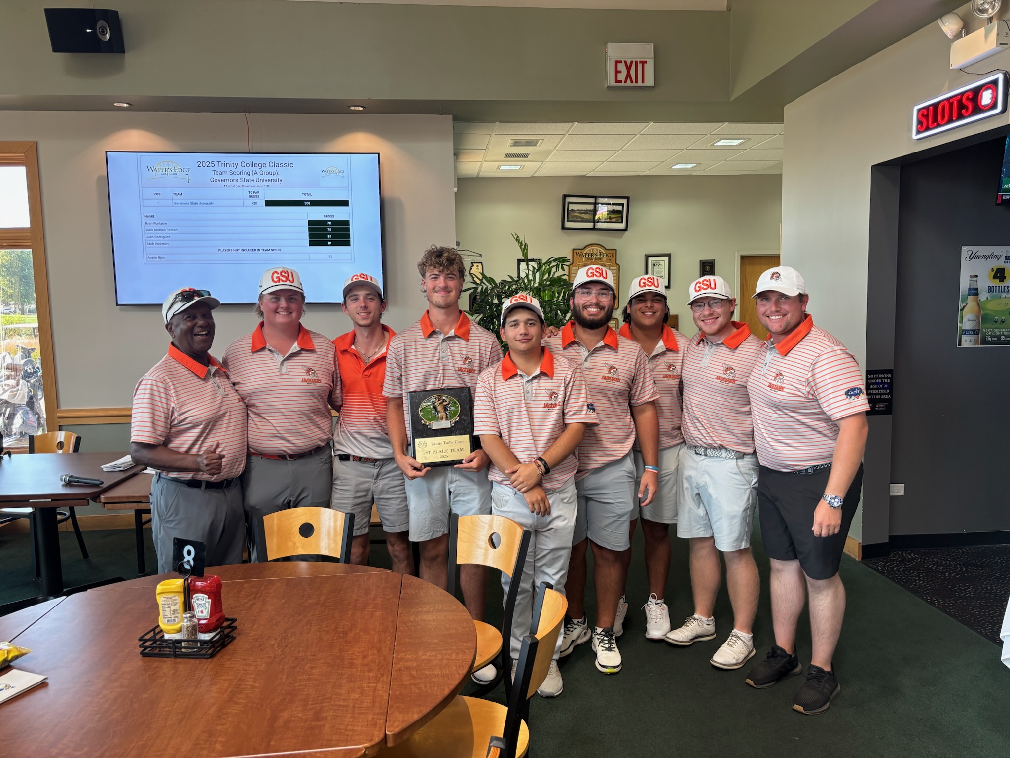 (L) Coach Fred Hawkins with his Jaguars men's golf team with the team championship trophy - 2025 Trinity Christian Fall Tournament - September 29 - Water's Edge Golf Course, Alsip, IL.