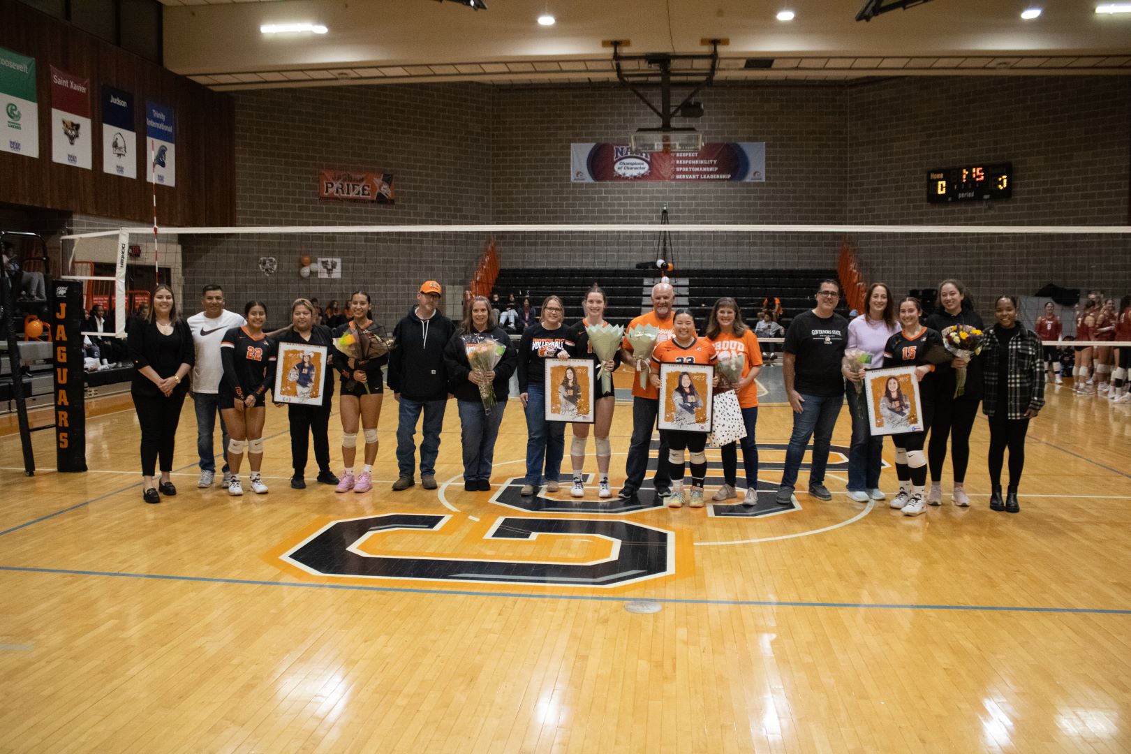 GovState seniors with Coach Reyes, (far left) and graduate assistant Gabriela Barbosa (far right) and their families (L-R)- Yareli Pacheco, Hayley Stewart, Emma Marcukaitis, and Julianne Ortiz.
